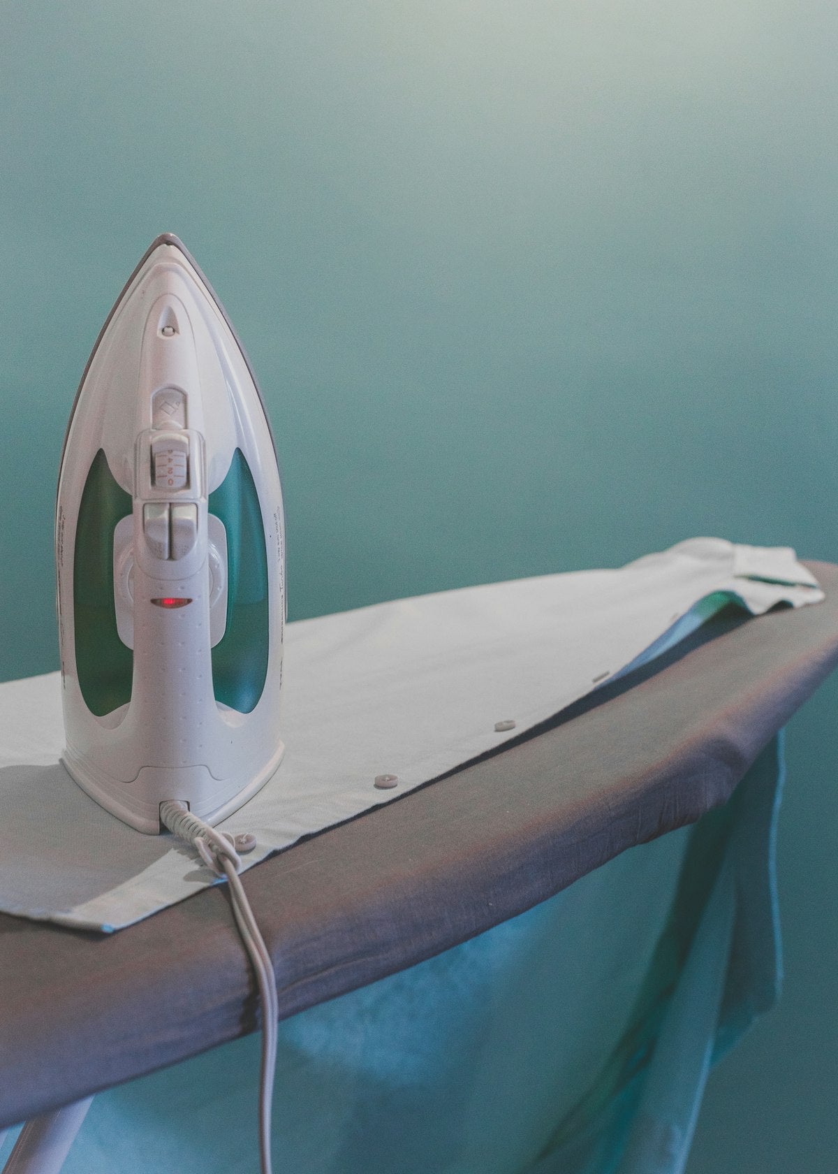 Ironing board with cover, angle view