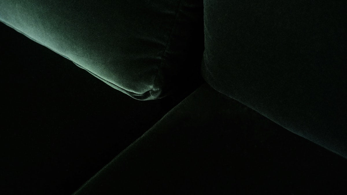 Velvet accent armchair, emerald green, angle view