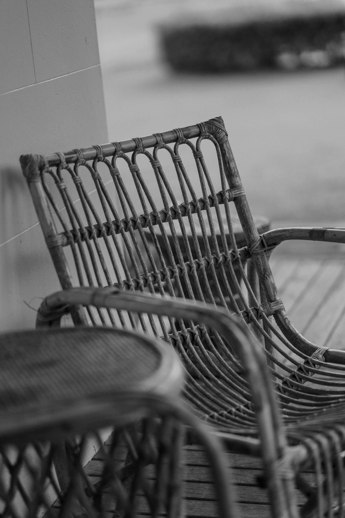 Rattan-effect garden armchair, side angle