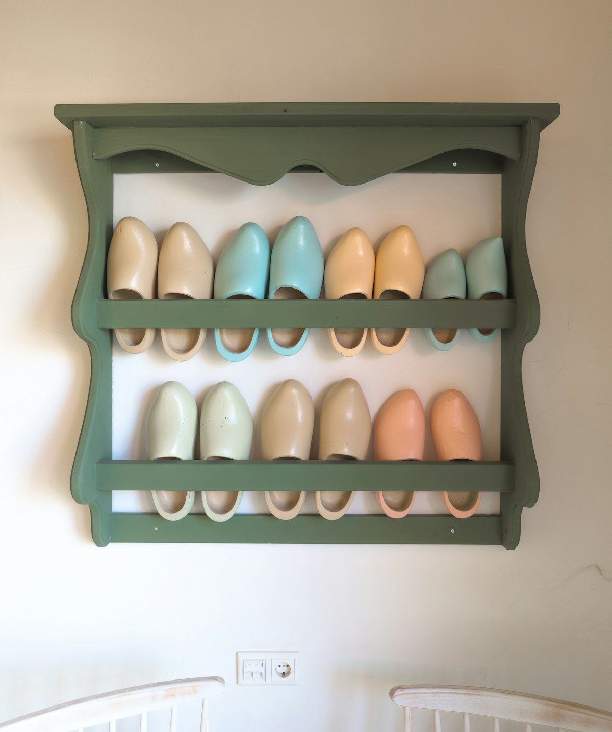 Wall-mounted shoe storage rack, styled hallway view